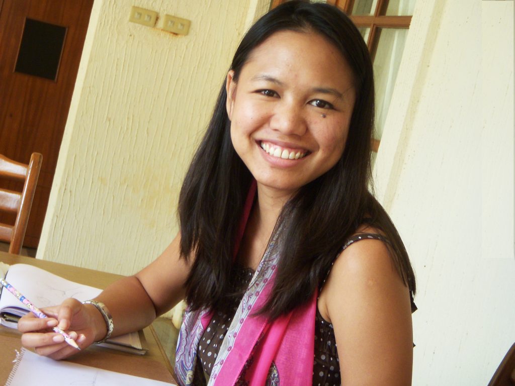 A public relations professional at her desk in Thailand